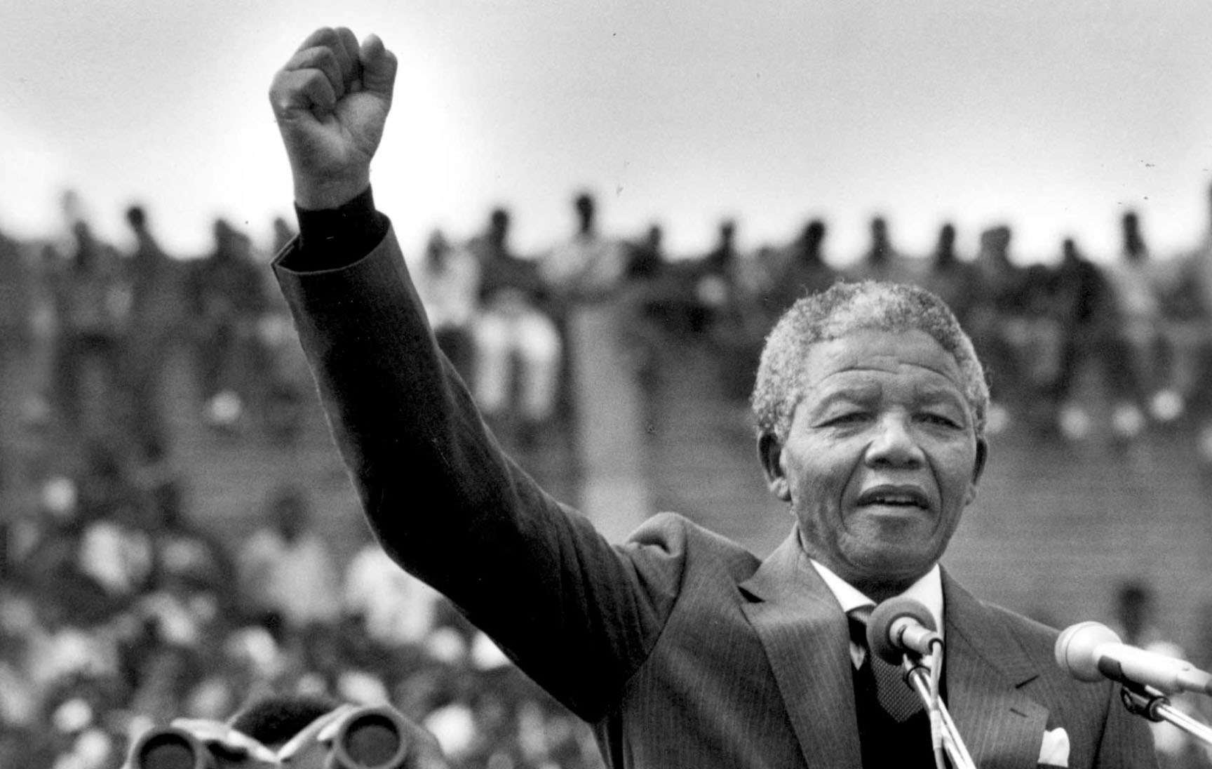 Black and white portrait of Nelson Mandela with his fist in the air